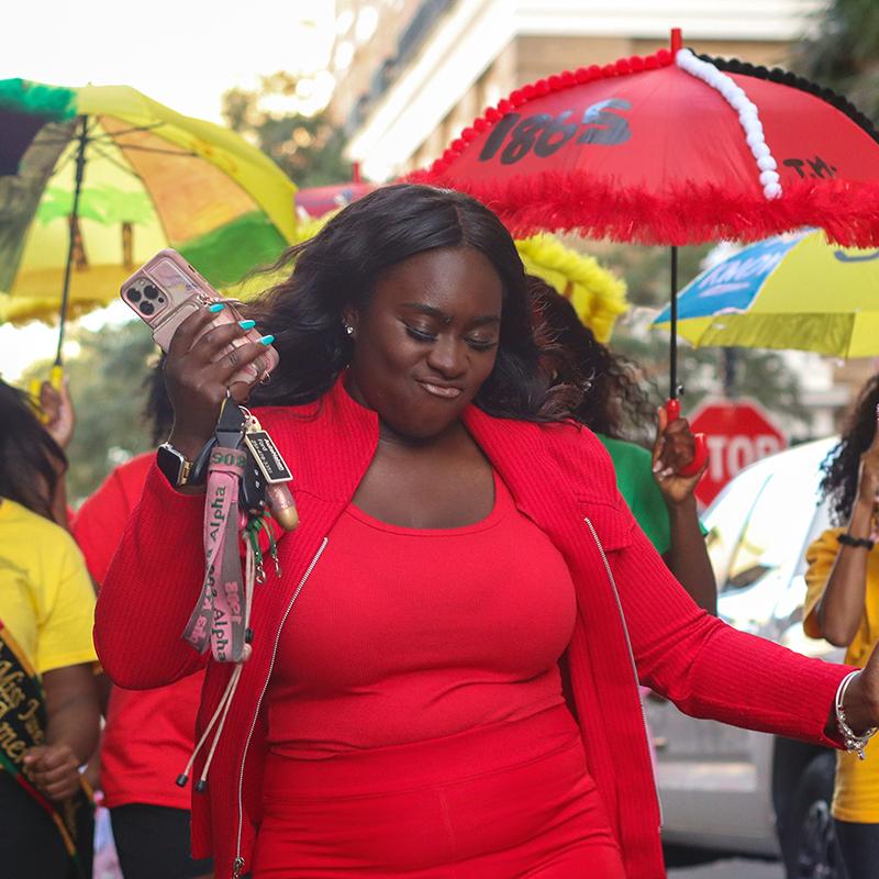 Christina Harris participating in a Miss Juneteenth America Second Line Parade in Mobile, Alabama