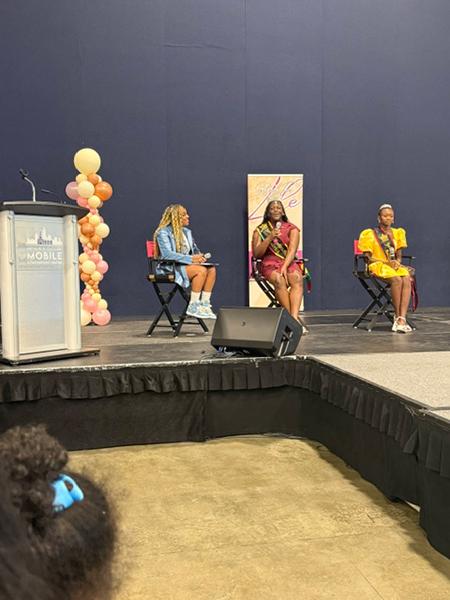 Young queens and panel participants together at the Sisters for Life Wellness Expo in Mobile, Alabama.