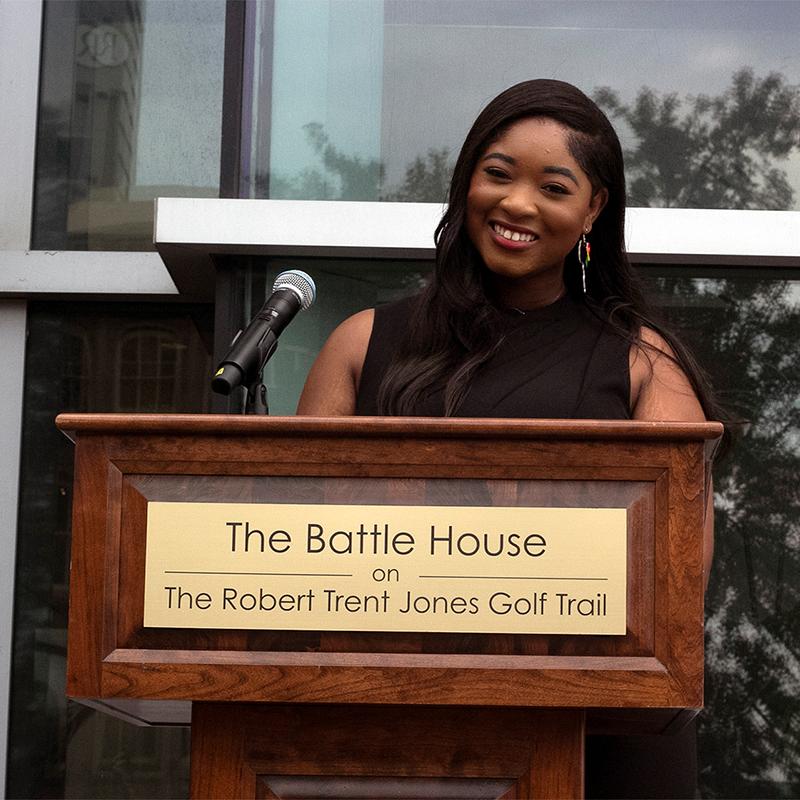 Shamonee Baker speaking at a Miss Juneteenth America event in Mobile, Alabama.