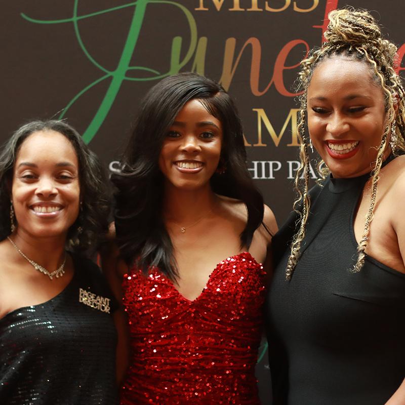 Simone Sharod with Miss Juneteenth America leadership during a program event.