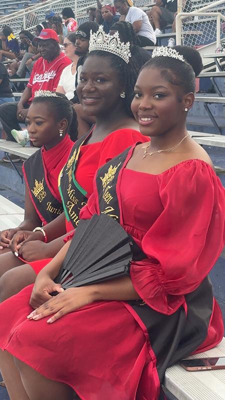 Miley Jones, Queen Erin Hammond, and Cayliegh Humphrey seated together during the 2026 Port City Classic.