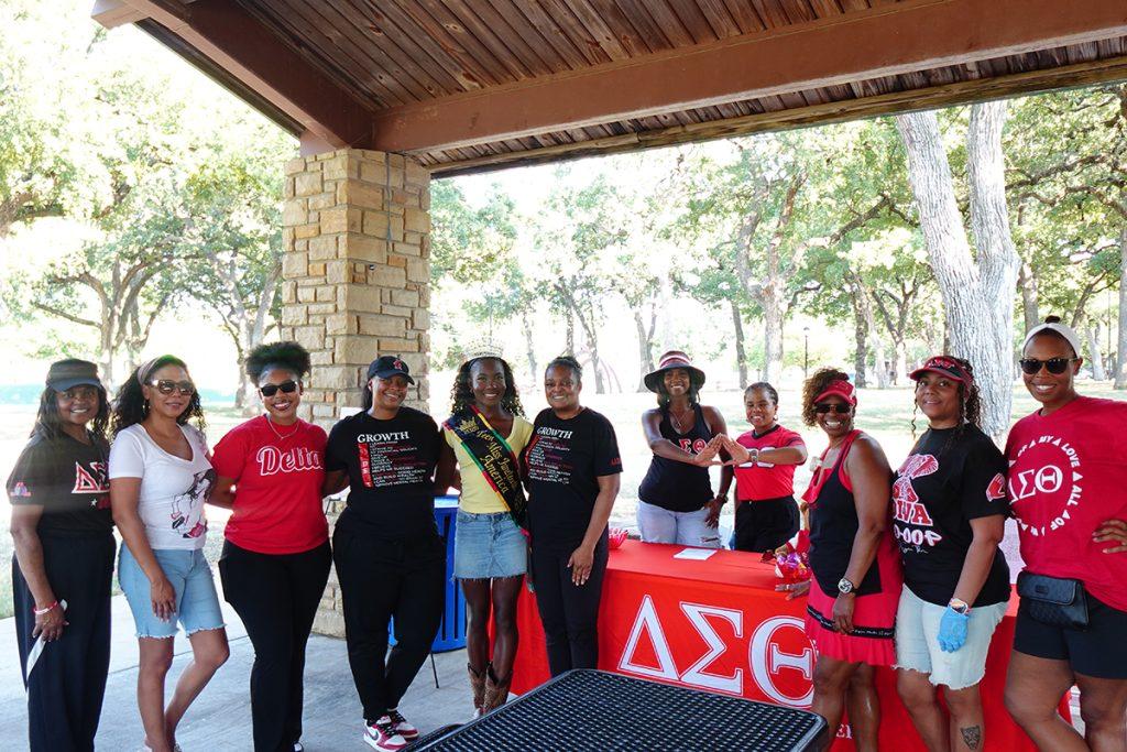 Queen Tammy Maku with community volunteers at the Junior Ezeonu Back-to-School Bash in Mansfield, Texas.